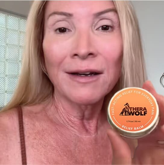 Kathryn M. holding TheraWolf Neuro Balm