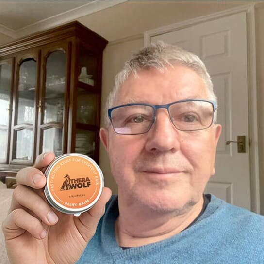 Nicholas L. holding TheraWolf Neuro Balm